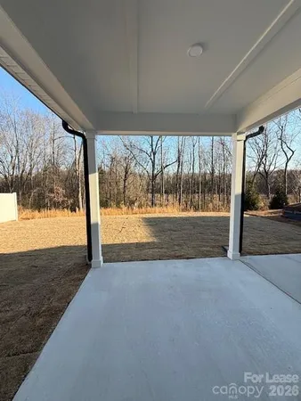 a view of porch with a yard