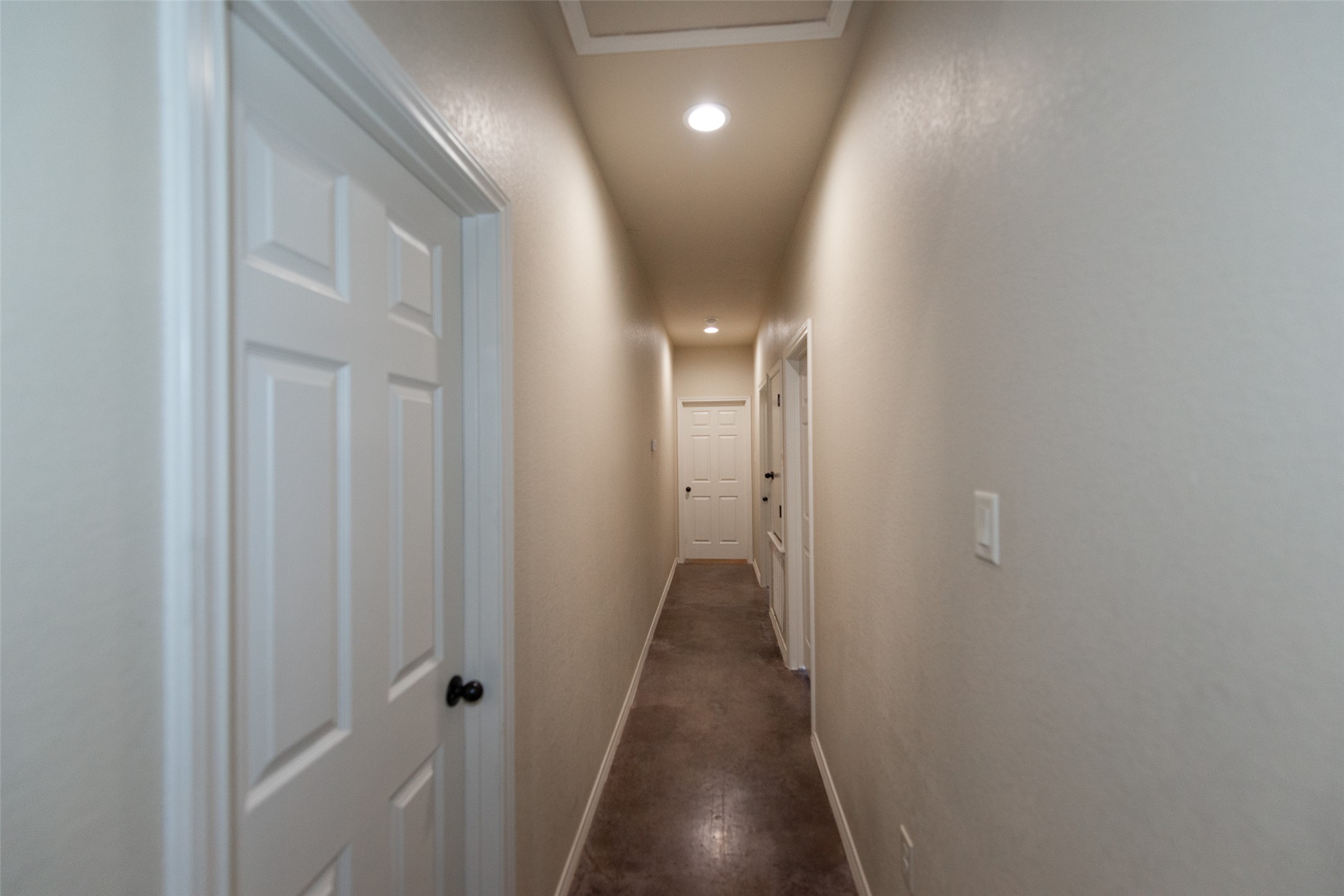 245 Joanne Loop, Unit B Buda, TX 78610 - Photo 13 of 33 Hall way which is wide, same as a full size door narrow is optical illusion from camera angle