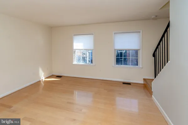 a view of an empty room with windows