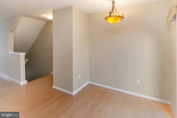 a kitchen with granite countertop a refrigerator and a stove