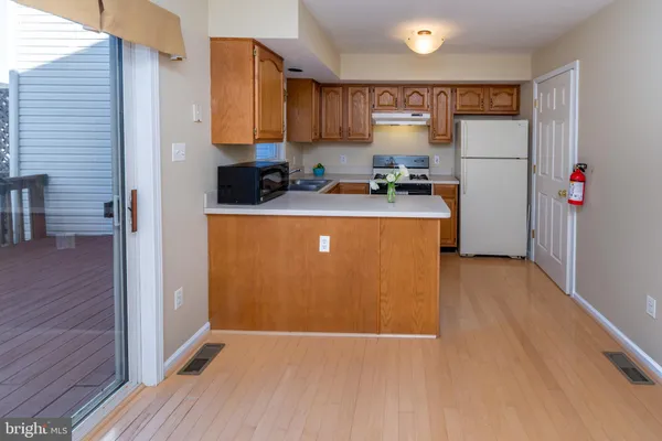 a kitchen with a refrigerator sink and stove