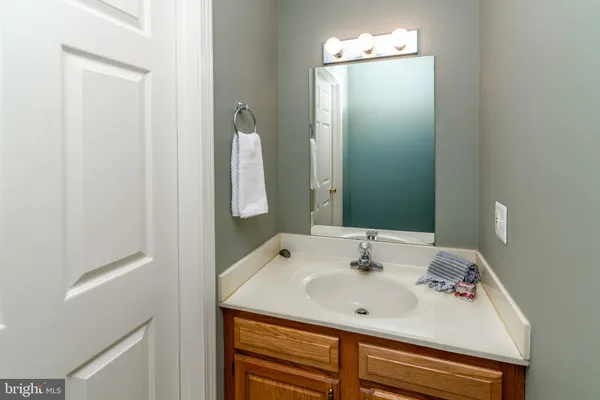 a view of a deck with wooden floor and a gate
