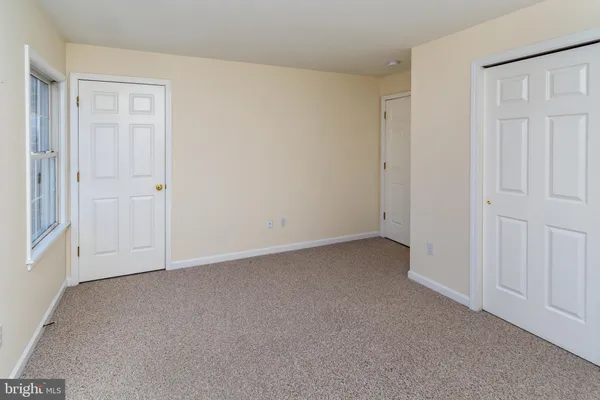 a bathroom with a sink mirror vanity and toilet