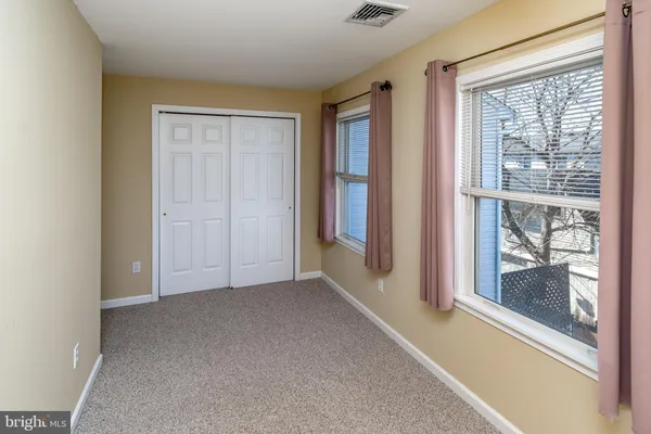 a view of a bedroom from a hallway
