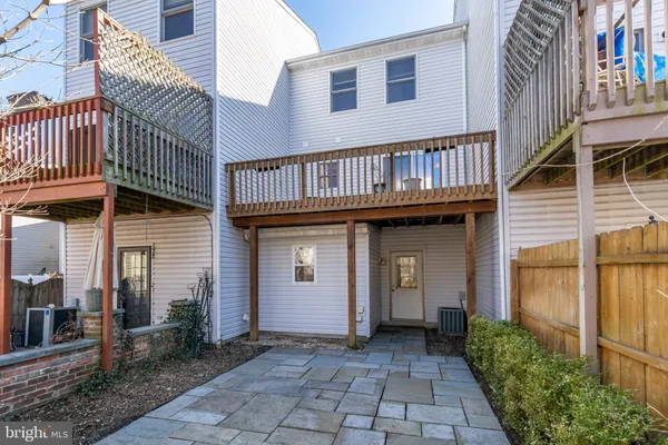 a view of a pathway both side of house