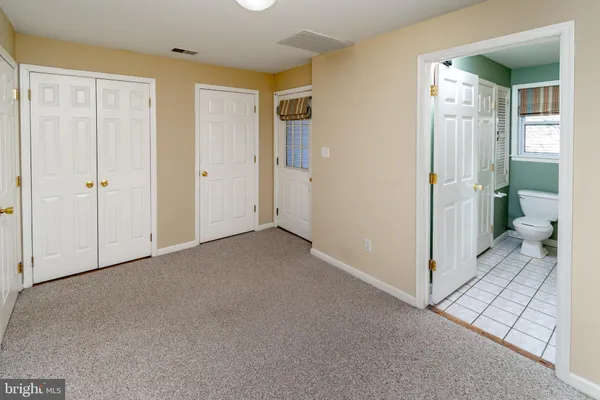 a view of a room with room and bathroom