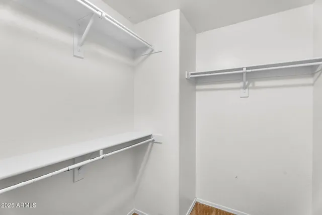 a bathroom with a sink shower and a mirror