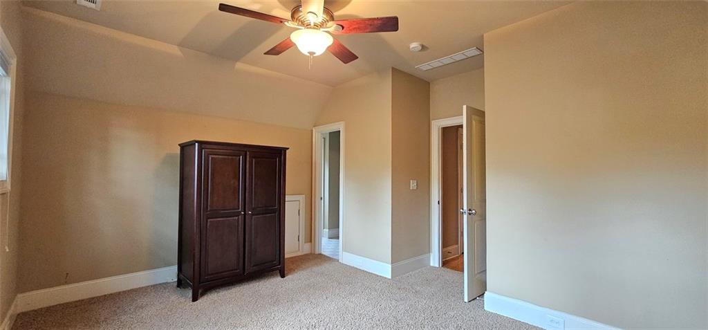 703 Pershing Avenue Southeast Atlanta, GA 30312 - Photo 15 of 26 an empty room with windows and fan