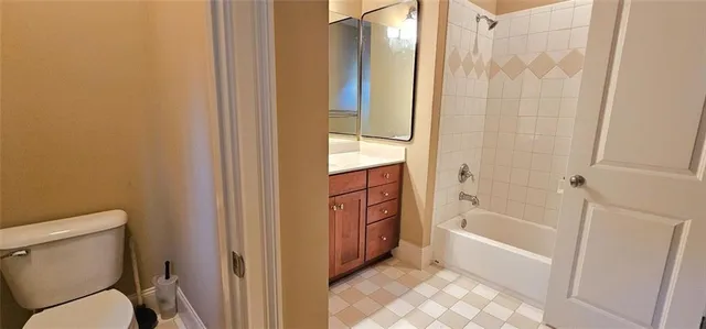 a bathroom with a tub toilet and sink