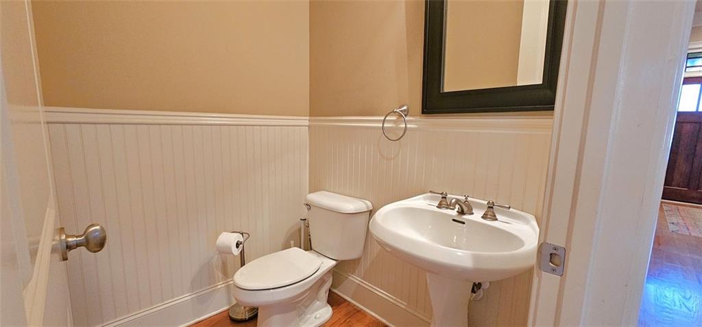 703 Pershing Avenue Southeast Atlanta, GA 30312 - Photo 19 of 26 a bathroom with a sink a toilet and a mirror