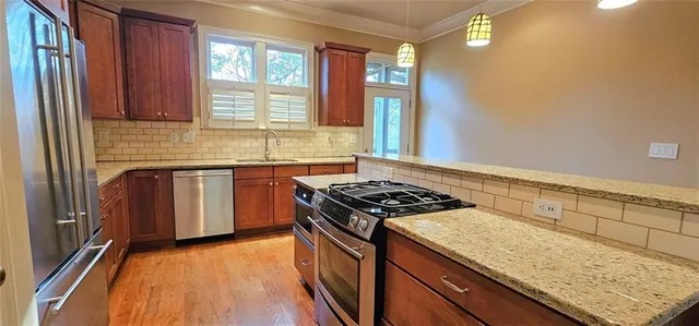 a kitchen with a stove and a sink
