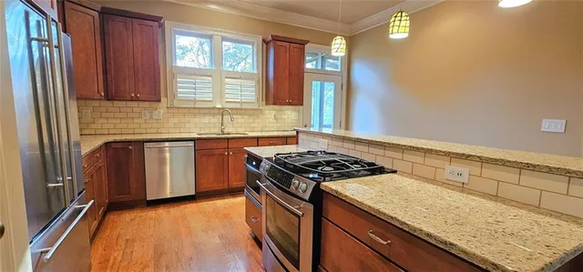 a kitchen with a stove and a sink
