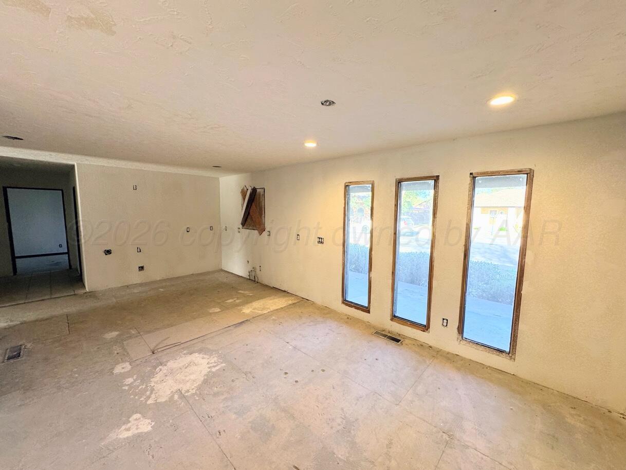 714 South Harvard Street Perryton, TX 79070 - Photo 4 of 27 a view of an empty room with a window