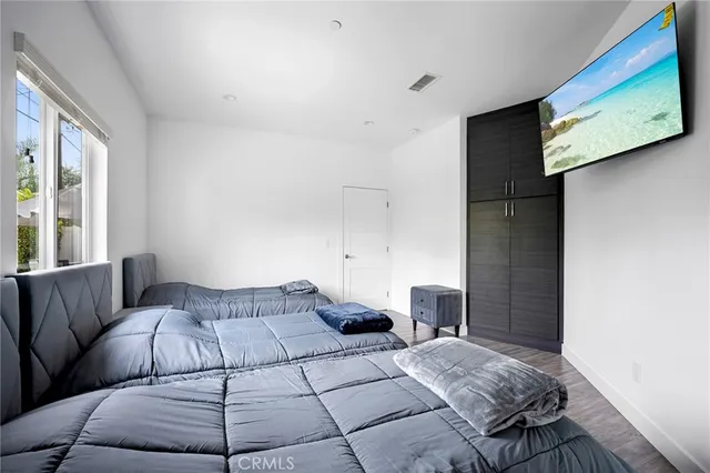 a bedroom with a bed and window