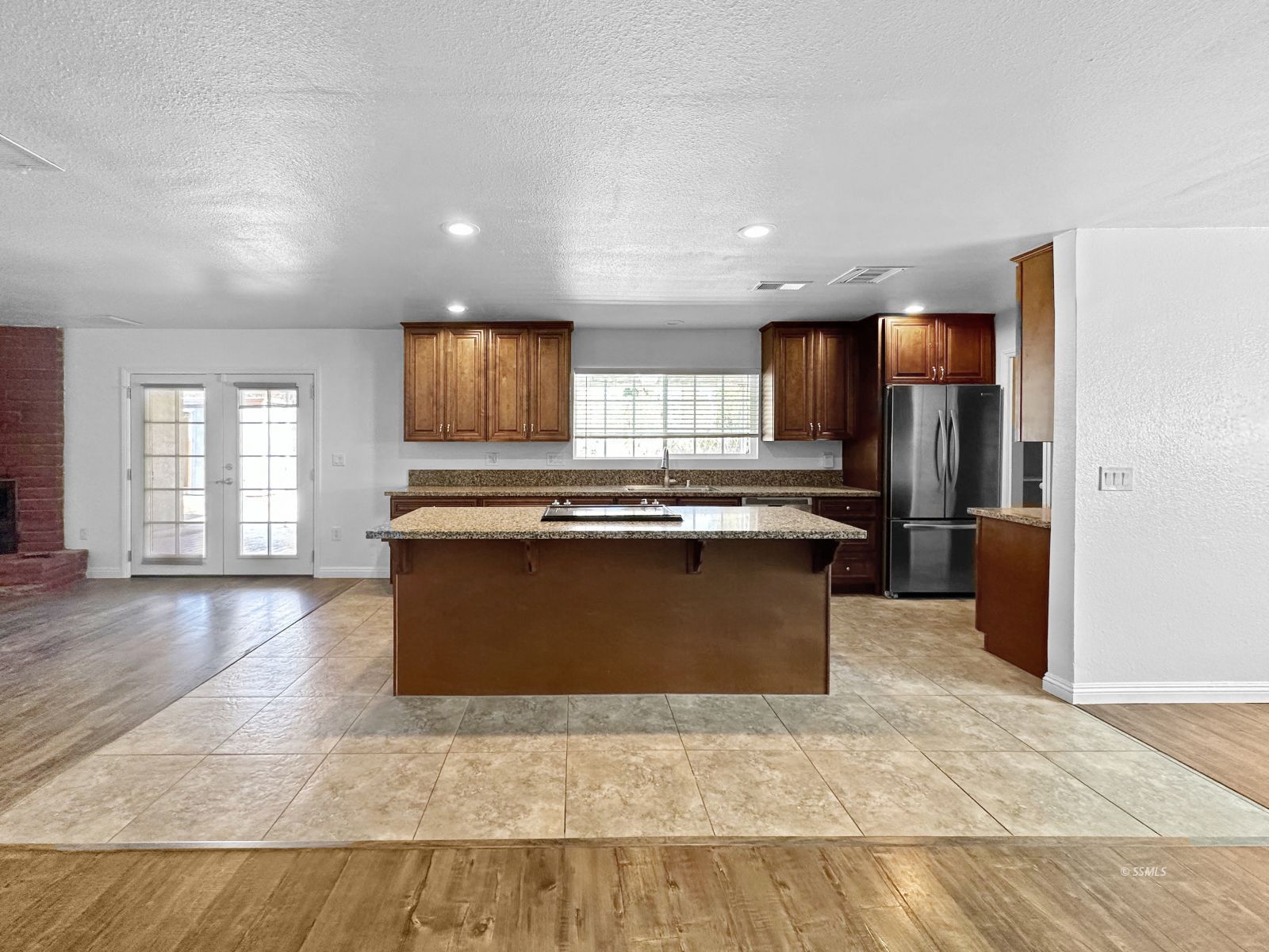 504 Randall Street Ridgecrest, CA 93555 - Photo 10 of 29 a kitchen with stainless steel appliances granite countertop a stove a sink and a refrigerator