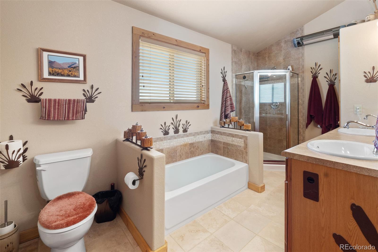1163 Michigan Hill Road Jefferson, CO 80456 - Photo 31 of 48 a bathroom with a sink a toilet and a bathtub