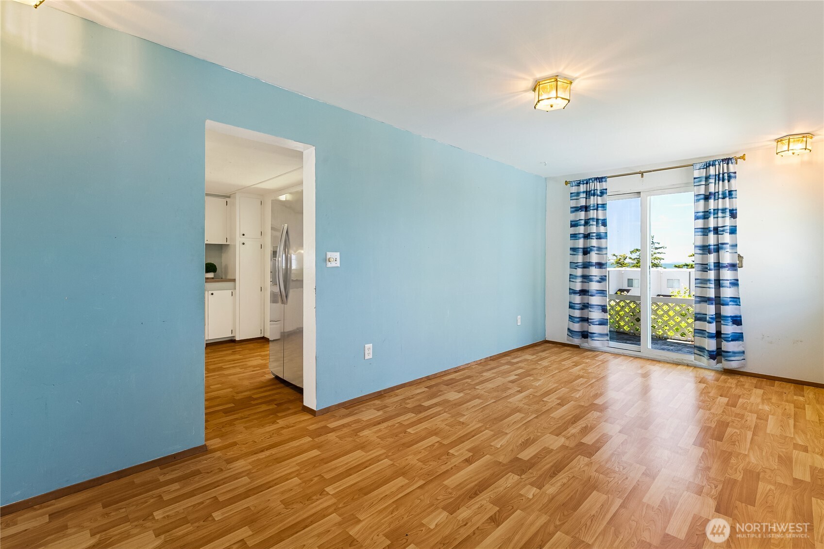 8080 Harborview Road, Unit 167 Blaine, WA 98230 - Photo 5 of 27 a view of an empty room with a window and wooden floor