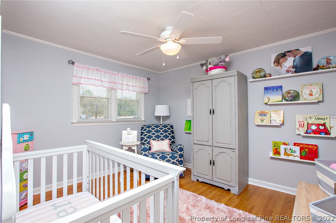 7845 Maxwell Road Stedman, NC 28391 - Photo 16 of 31 a bedroom with furniture and a window