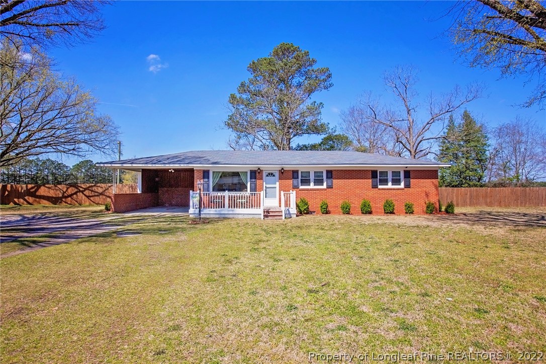 7845 Maxwell Road Stedman, NC 28391 - Photo 23 of 31 a front view of a house with a yard