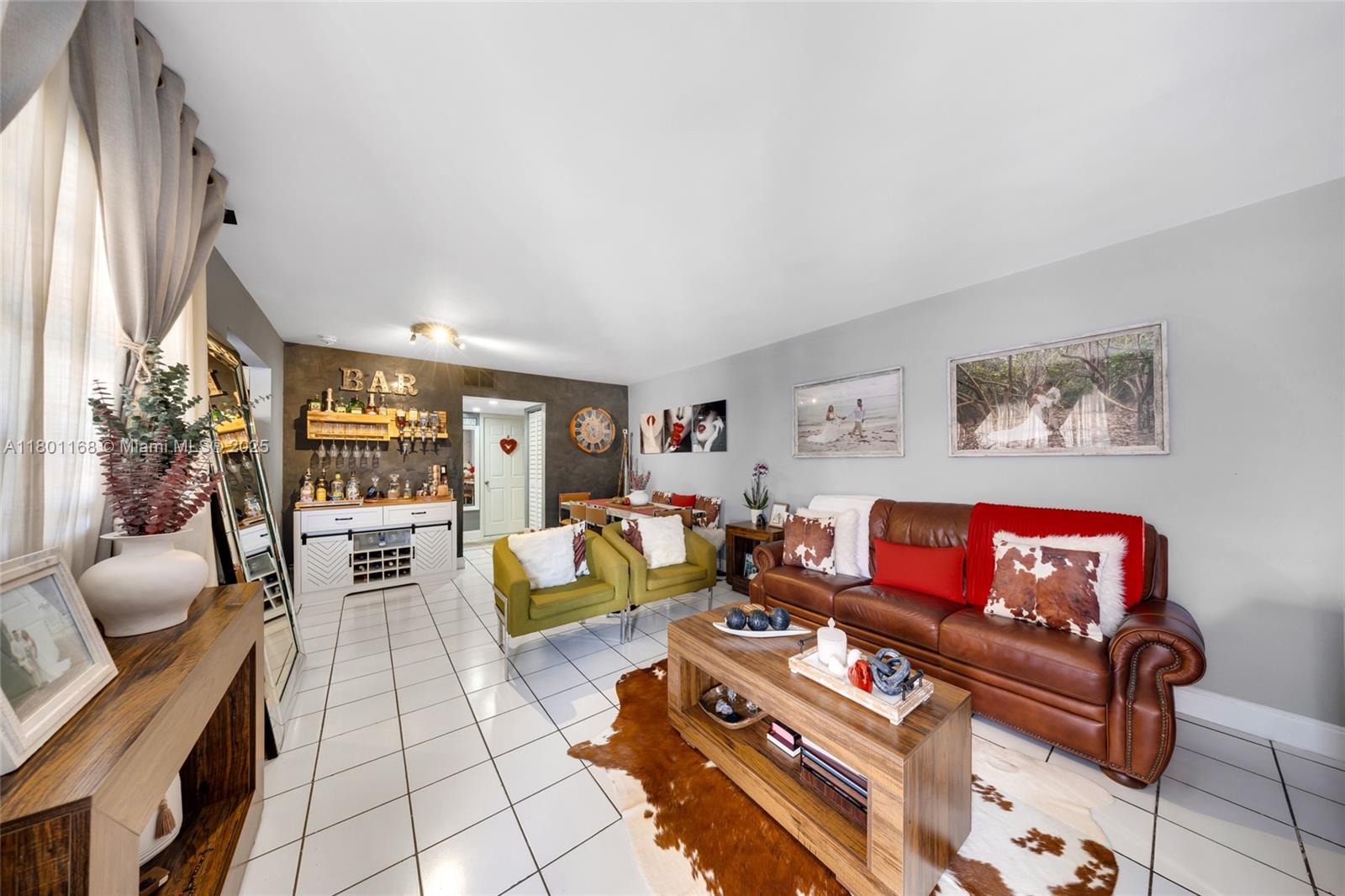 569 Southwest 4th Street Miami, FL 33130 - Photo 3 of 5 a living room with furniture and a large window