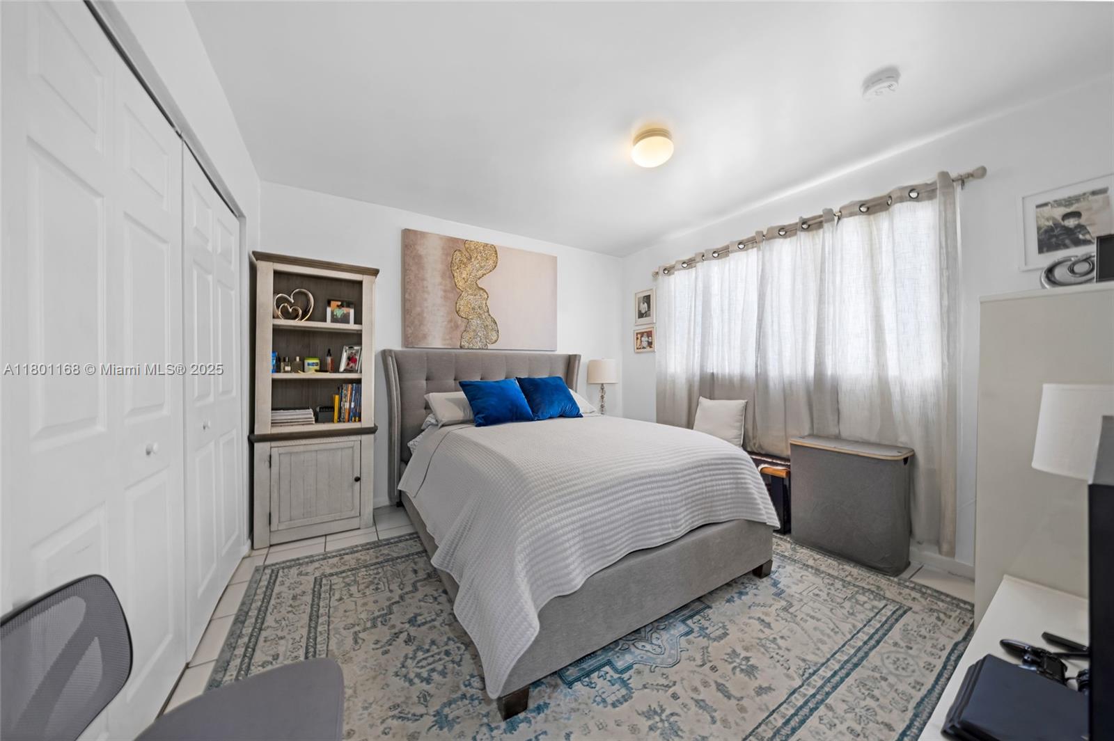 569 Southwest 4th Street Miami, FL 33130 - Photo 4 of 5 a bedroom with a large bed and a couch