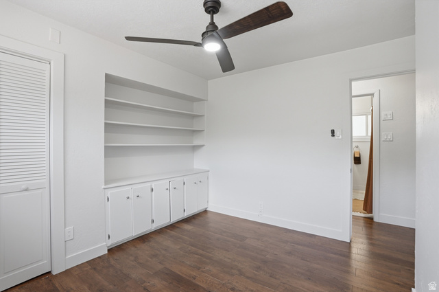 6889 South Village Road Salt Lake City, UT 84121 - Photo 20 of 44 Bedroom 1 with Built-in shelving and cabinetry.
