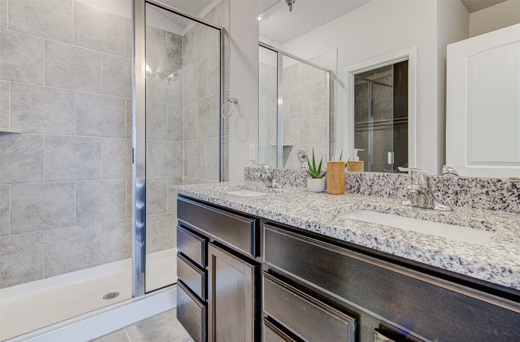 316 Pepper Mill Loop Burnet, TX 78611 - Photo 14 of 27 Double vanity with granite counters and an adjacent walk-in shower provide optimal function and style.