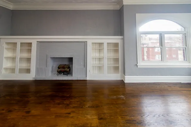 an aerial view of a residential apartment building with a yard
