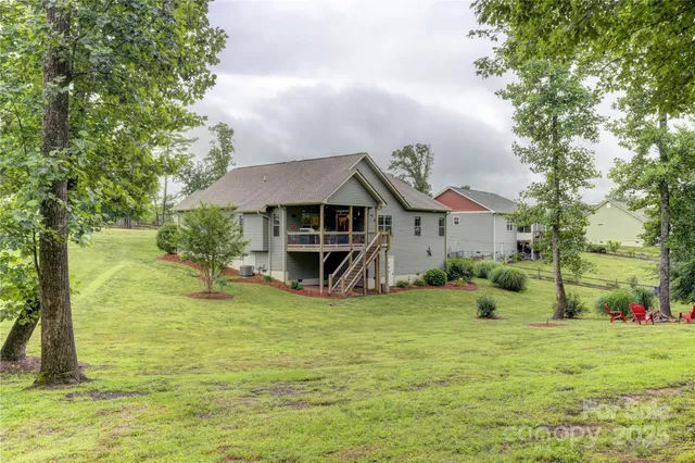 a view of a house with a yard porch and sitting area