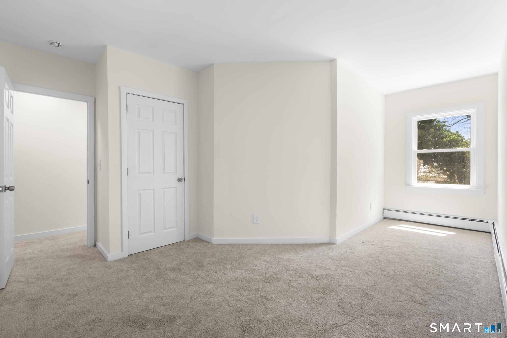704 Maple Street, Unit 704 Bridgeport, CT 06608 - Photo 13 of 15 a view of an empty room with a window