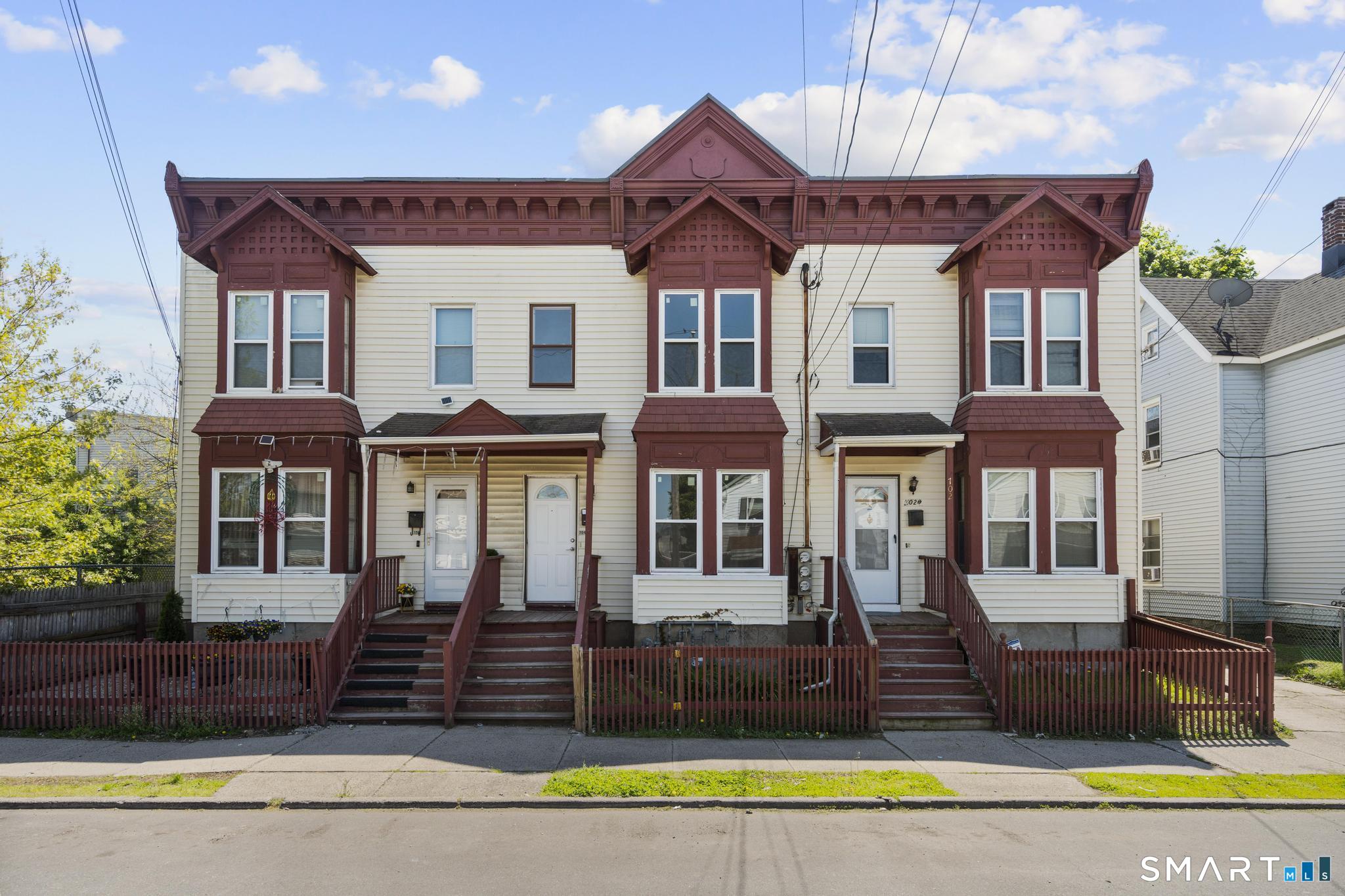 704 Maple Street, Unit 704 Bridgeport, CT 06608 - Photo 2 of 15 a front view of a house with a swimming pool