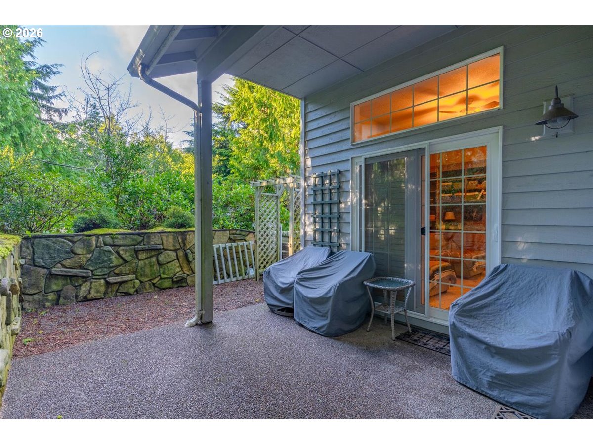 140 Gull Station Depoe Bay, OR 97341 - Photo 23 of 48 a view of a chair and table in the back yard of the house