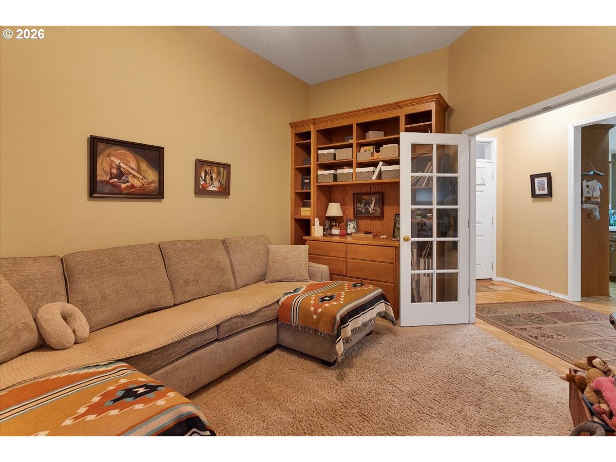 140 Gull Station Depoe Bay, OR 97341 - Photo 26 of 48 a living room with a couch and a bookshelf
