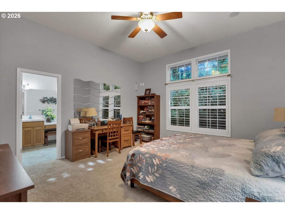 140 Gull Station Depoe Bay, OR 97341 - Photo 27 of 48 a bedroom with a bed and a chandelier