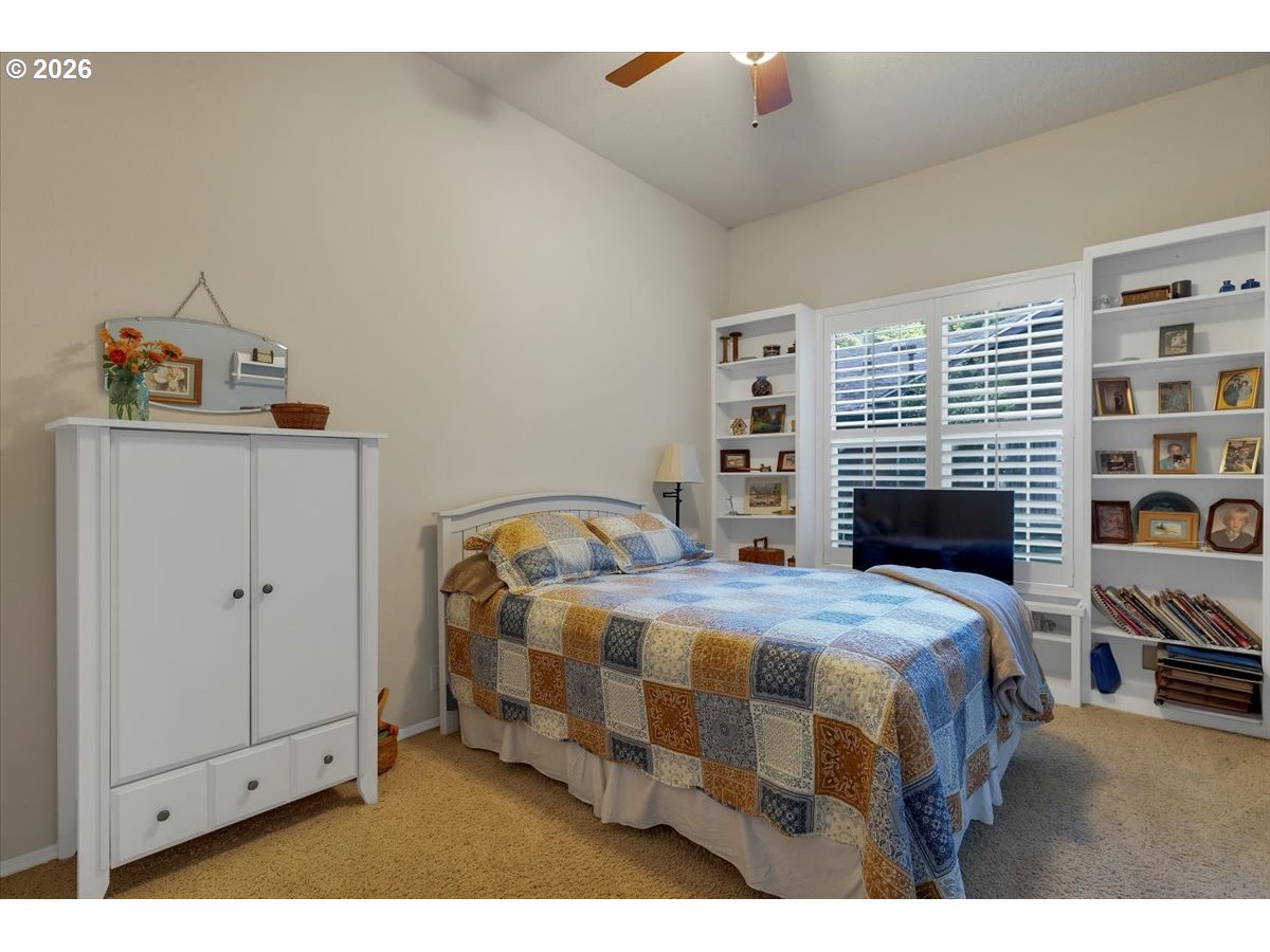 140 Gull Station Depoe Bay, OR 97341 - Photo 32 of 48 a bedroom with a bed and a book shelf