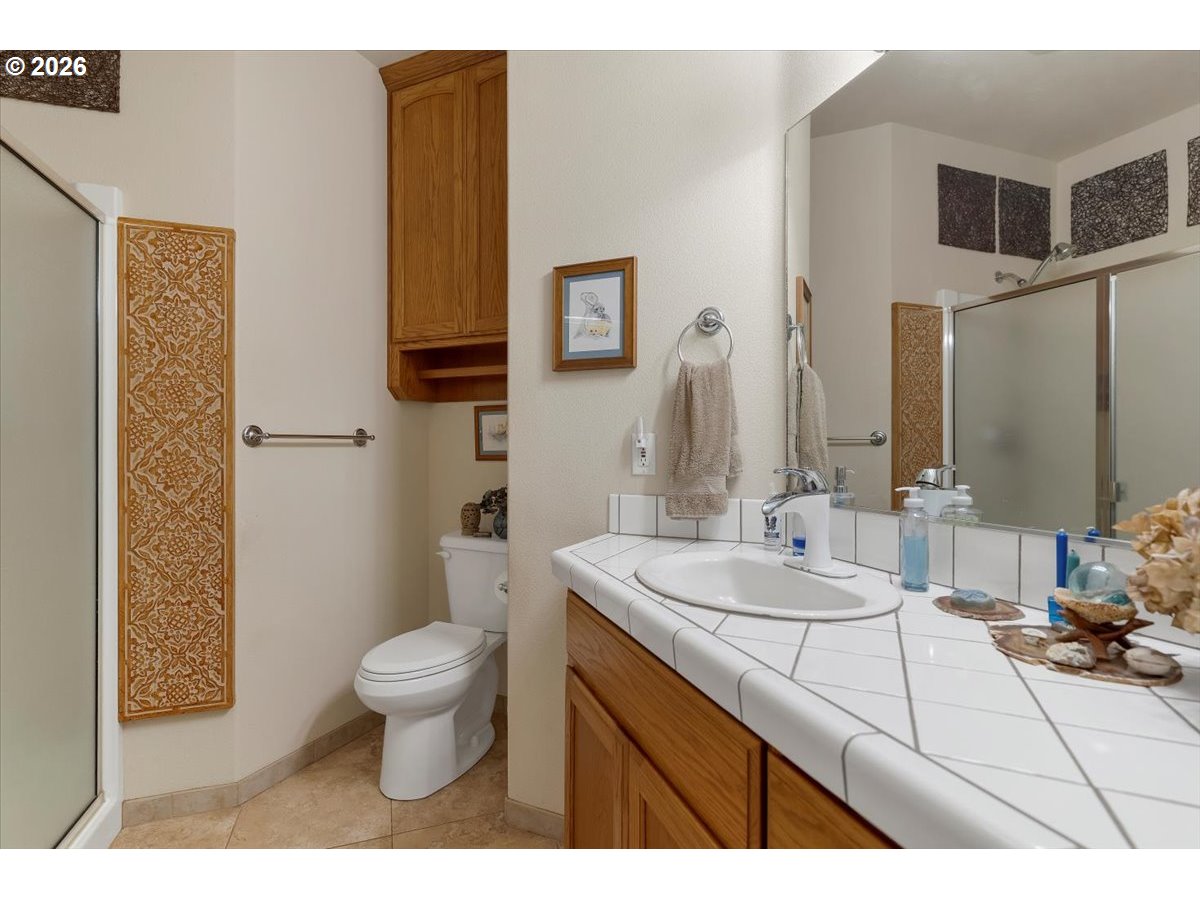 140 Gull Station Depoe Bay, OR 97341 - Photo 35 of 48 a bathroom with a sink toilet and shower