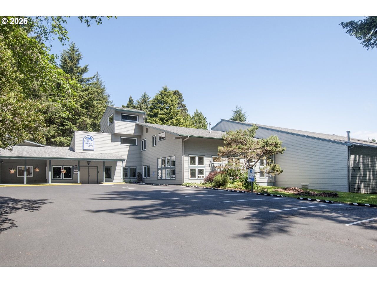 140 Gull Station Depoe Bay, OR 97341 - Photo 39 of 48 a front view of a house with a yard and garage