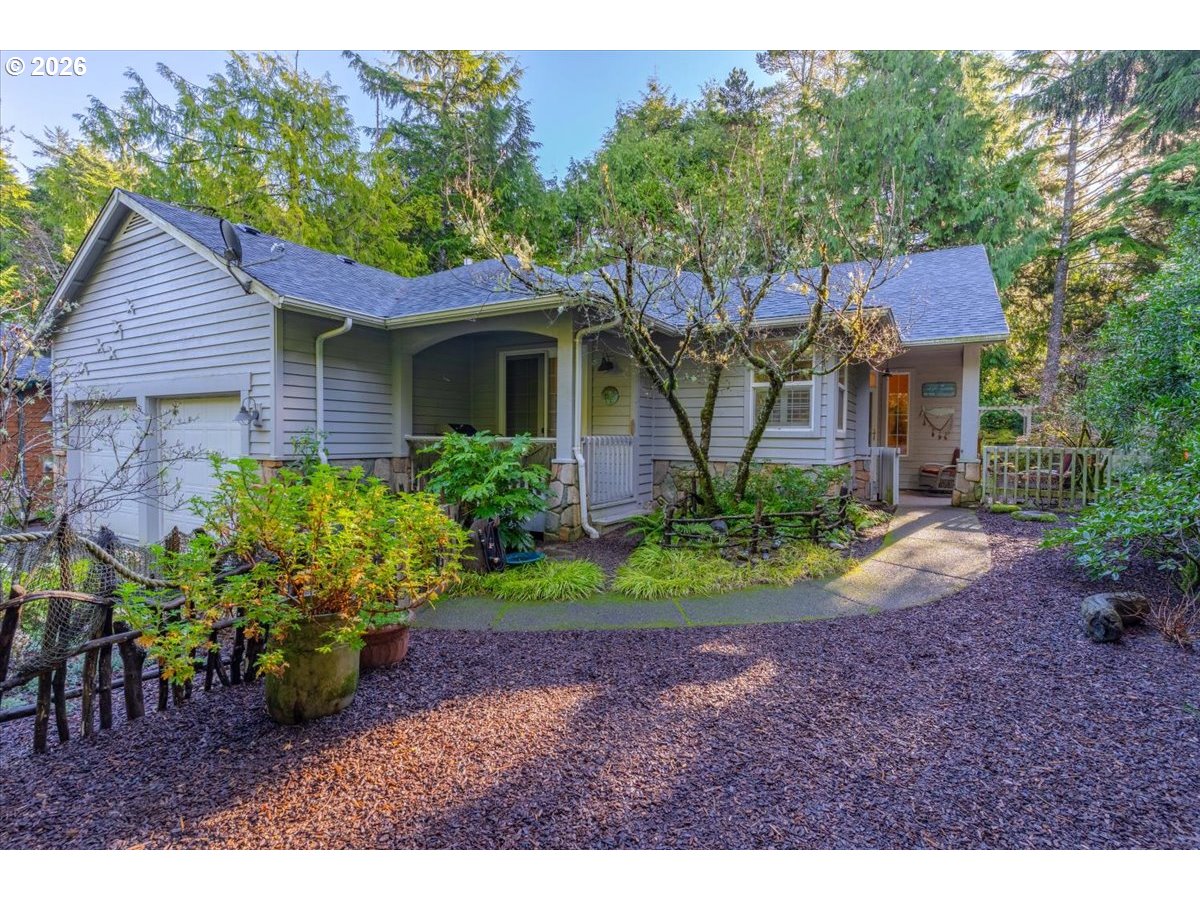 140 Gull Station Depoe Bay, OR 97341 - Photo 6 of 48 a front view of a house with garden