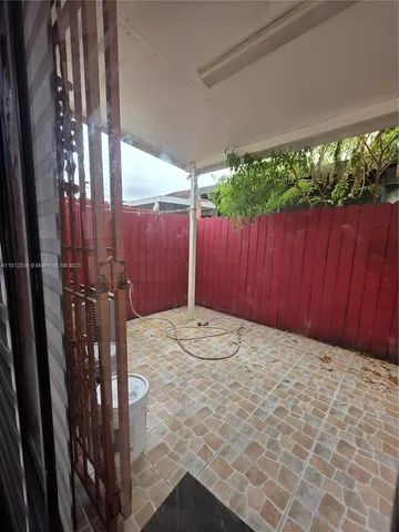 a view of a backyard of the house