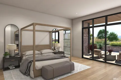 a bedroom with furniture and large windows