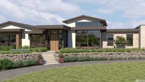 a front view of a house with a garden and plants