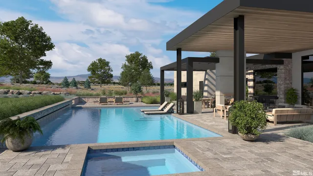 a view of a house with sitting area and swimming pool