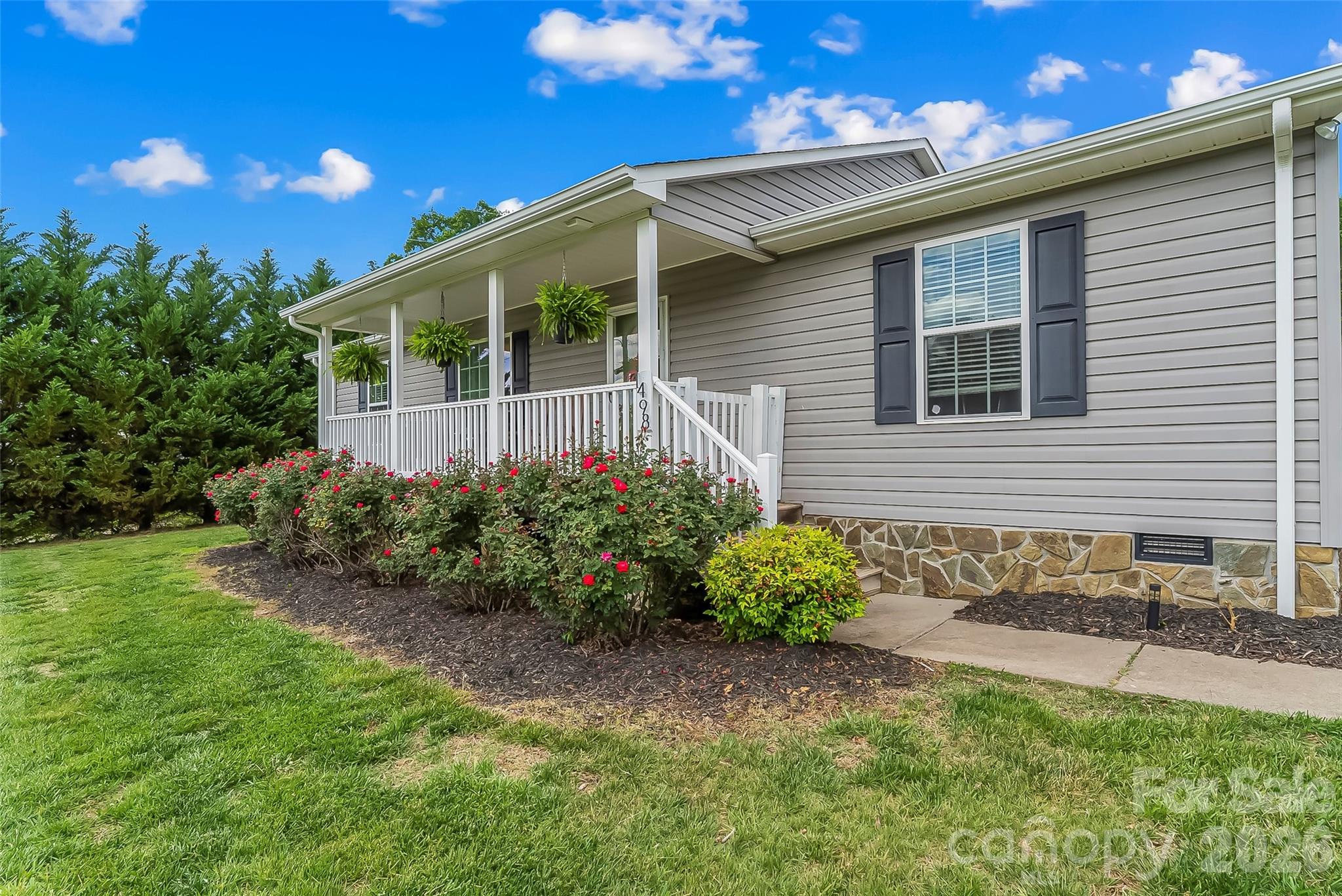 1498 Salem Road Morganton, NC 28655 - Photo 4 of 32 a front view of a house with garden