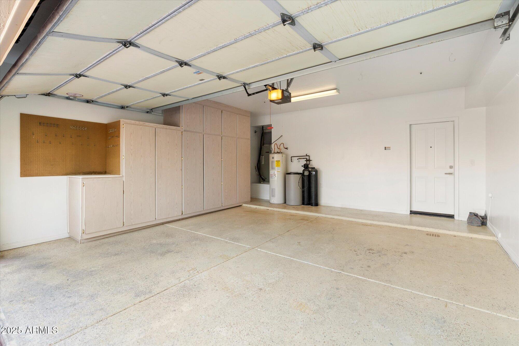 7955 East Chaparral Road, Unit 17 Scottsdale, AZ 85250 - Photo 53 of 57 2 Car Garage with Storage Cabinets