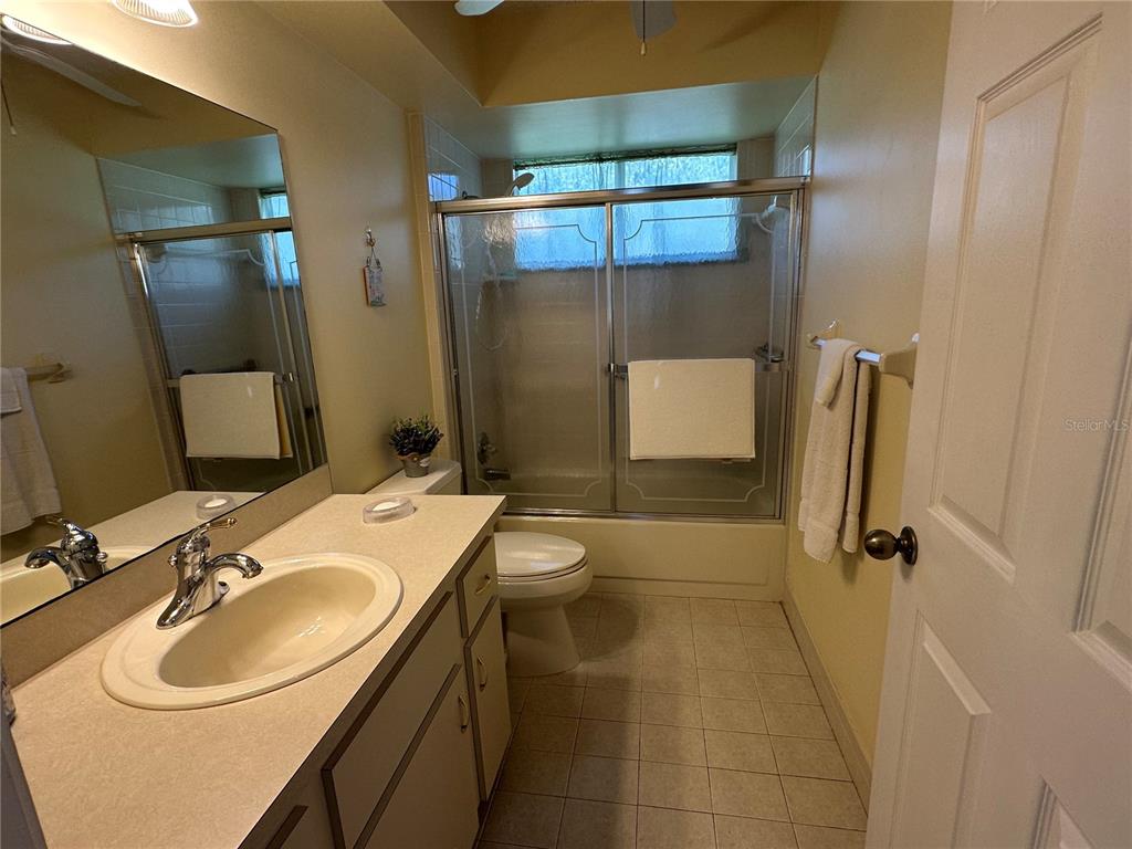 8981 Southwest 116th Street Road Ocala, FL 34481 - Photo 24 of 28 a bathroom with a sink toilet and shower
