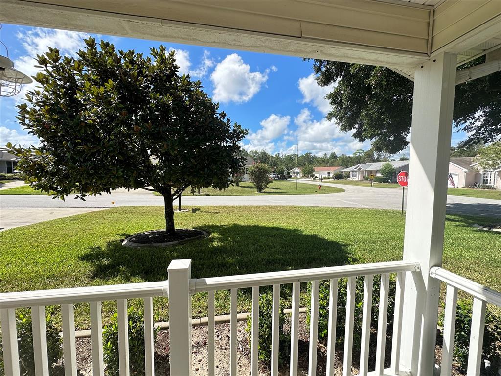 8981 Southwest 116th Street Road Ocala, FL 34481 - Photo 5 of 28 a view of a porch with a yard