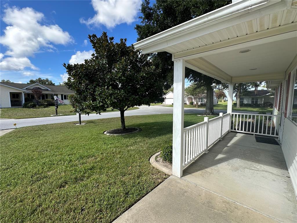 8981 Southwest 116th Street Road Ocala, FL 34481 - Photo 6 of 28 a view of a porch with wooden fence