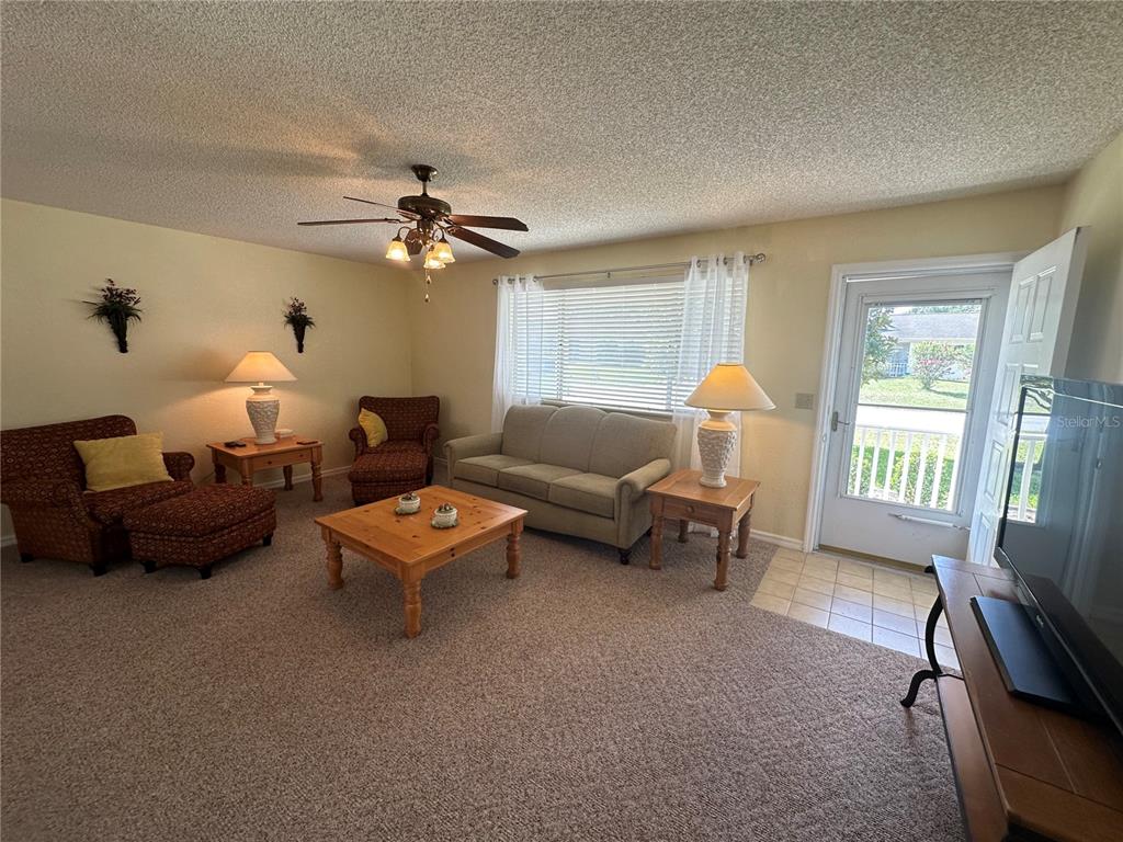 8981 Southwest 116th Street Road Ocala, FL 34481 - Photo 10 of 28 a living room with furniture and a window