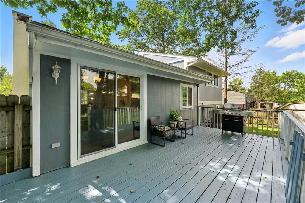2066 Powell Road Cranberry Township, PA 16066 - Photo 17 of 44 a view of a deck with table and chairs and wooden floor