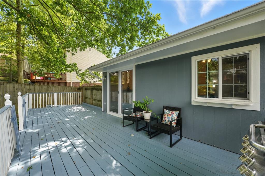 2066 Powell Road Cranberry Township, PA 16066 - Photo 18 of 44 a balcony with wooden floor table and chairs